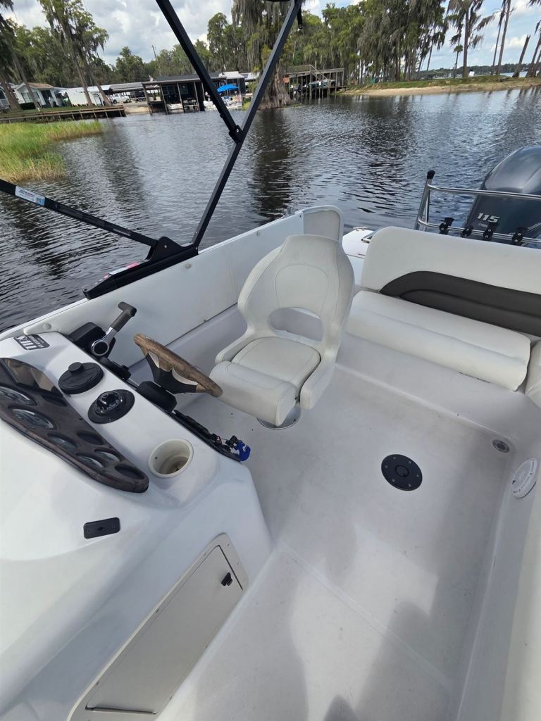 Hurricane's helm seat and console, with the 115 hp Yamaha outboard behind